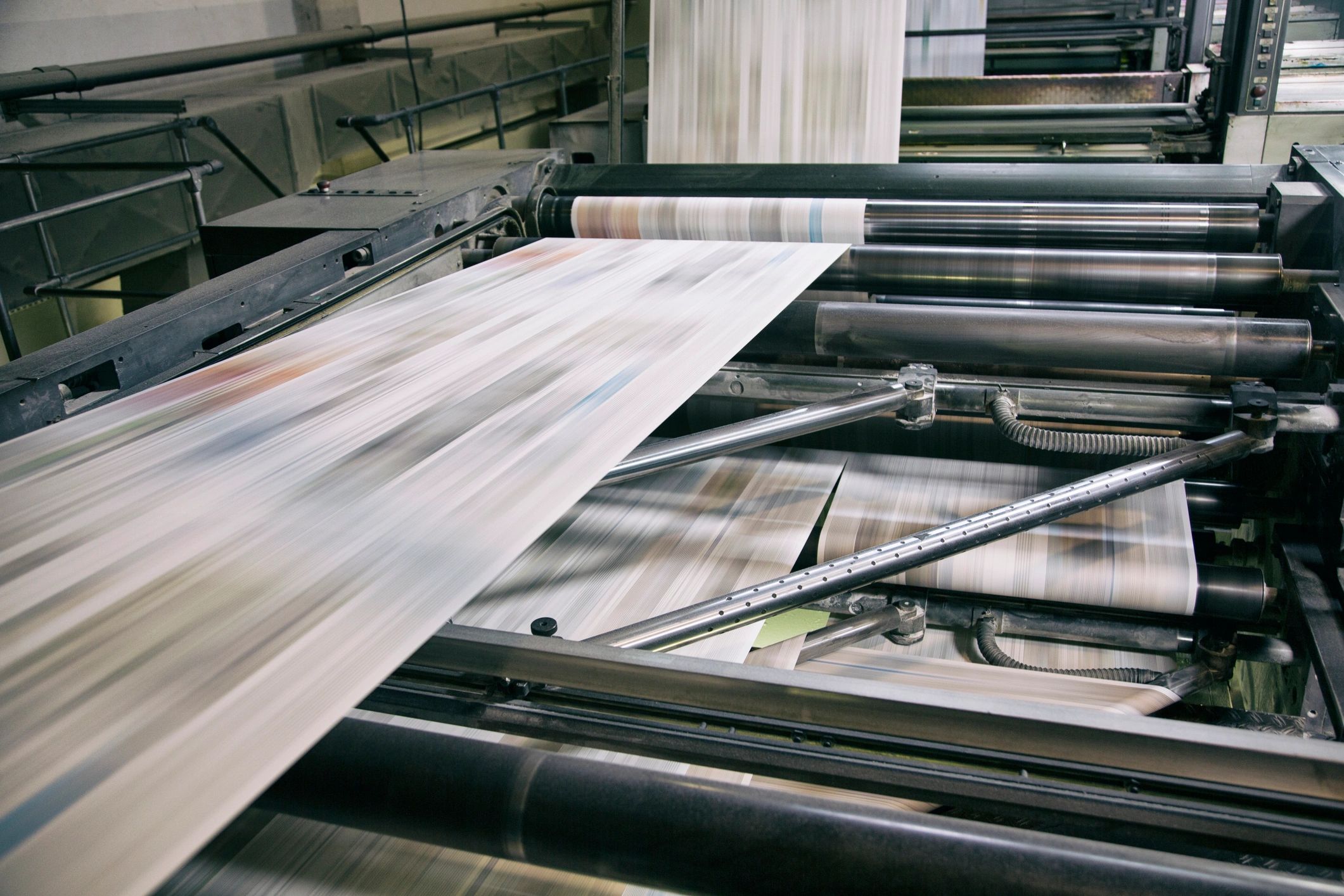 Printing press in action producing printed materials